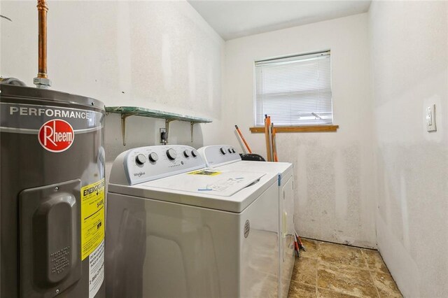 laundry room with water heater and washing machine and dryer