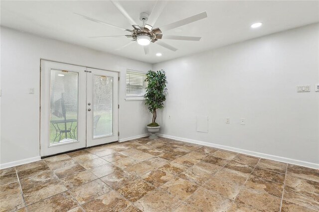 unfurnished room featuring ceiling fan and french doors