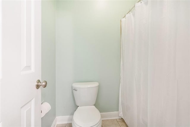 bathroom featuring tile patterned flooring and toilet