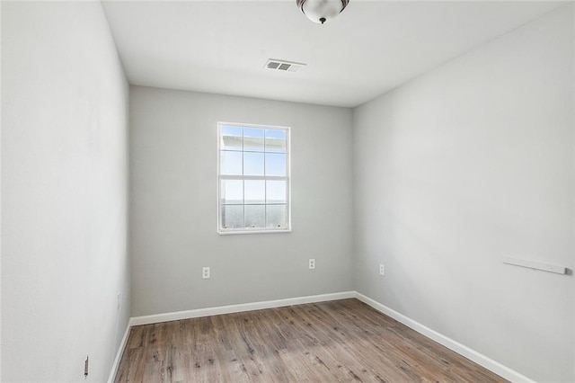 unfurnished room featuring light hardwood / wood-style flooring