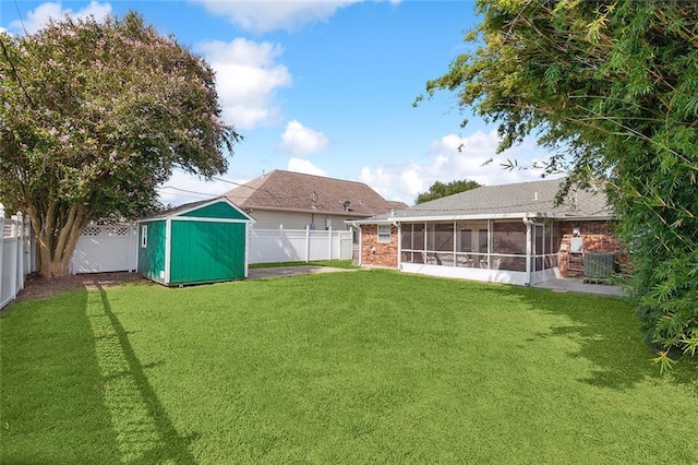 2525 Paul St, Meraux, LA 70075 - view of yard featuring a storage unit and a sunroom