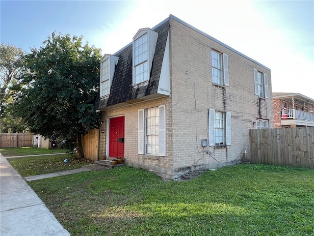 view of side of property with a yard