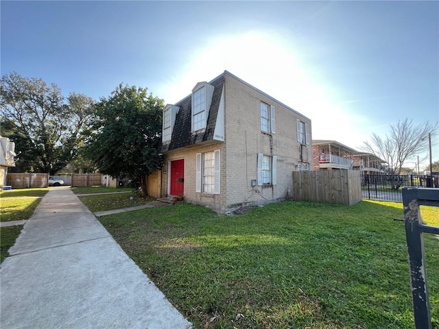 view of property exterior with a lawn