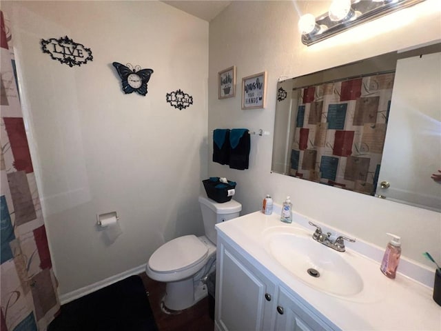 bathroom featuring vanity and toilet