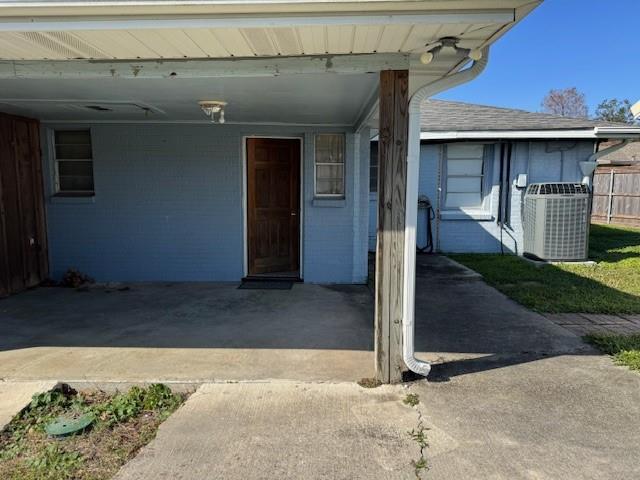 property entrance featuring central AC