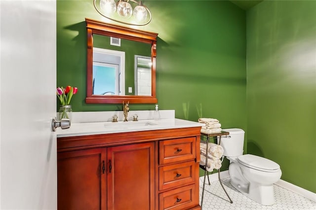 bathroom with vanity and toilet