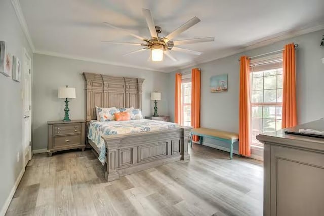 bedroom with ceiling fan, ornamental molding, and light hardwood / wood-style flooring