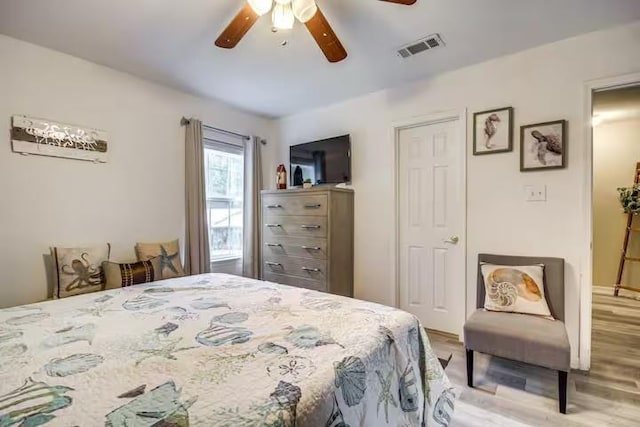 bedroom featuring ceiling fan and light hardwood / wood-style flooring