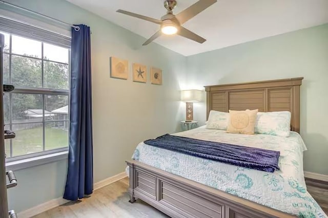 bedroom featuring ceiling fan and light hardwood / wood-style floors