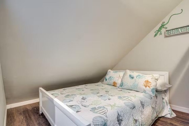 bedroom featuring dark hardwood / wood-style flooring