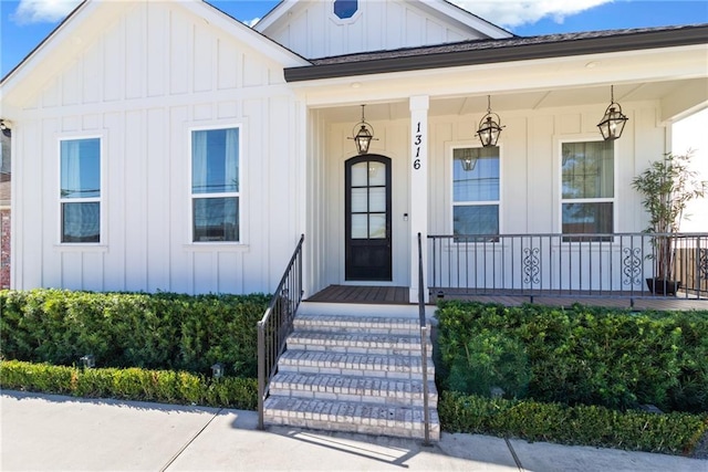 view of exterior entry featuring a porch