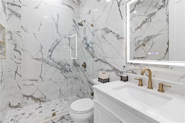 bathroom featuring vanity, toilet, a shower, and tile walls