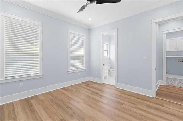 unfurnished bedroom featuring ensuite bath, ceiling fan, crown molding, and light hardwood / wood-style floors