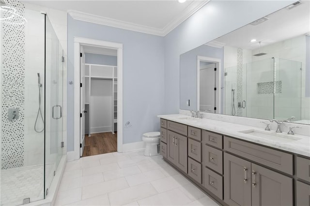 bathroom featuring walk in shower, tile patterned flooring, vanity, and ornamental molding