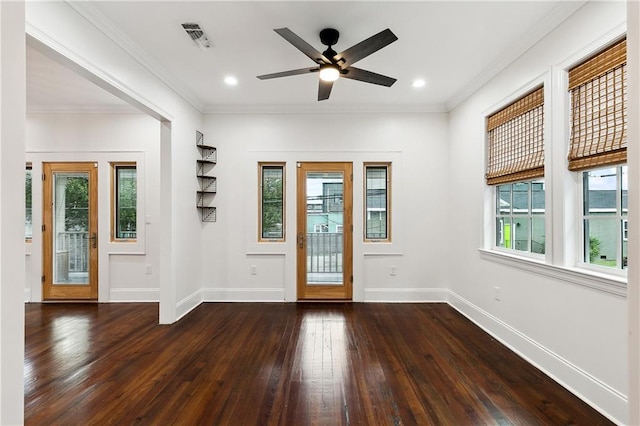 foyer entrance featuring crown molding, ceiling fan, plenty of natural light, and dark hardwood / wood-style floors