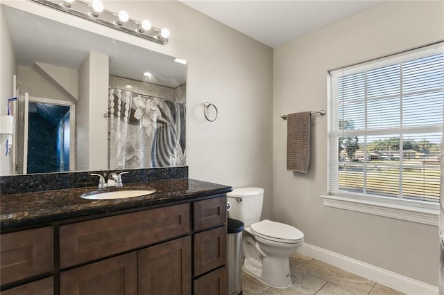 bathroom with toilet, vanity, tile patterned floors, and a shower with shower curtain