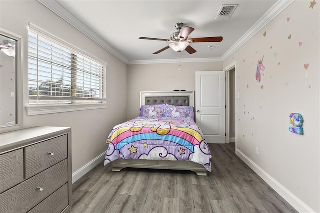 bedroom featuring hardwood / wood-style flooring, ceiling fan, and ornamental molding