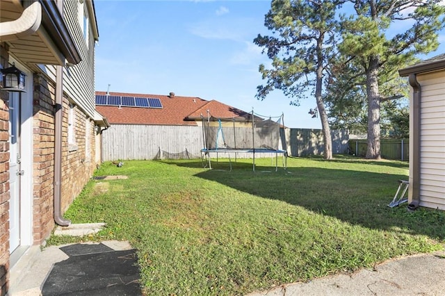 view of yard with a trampoline