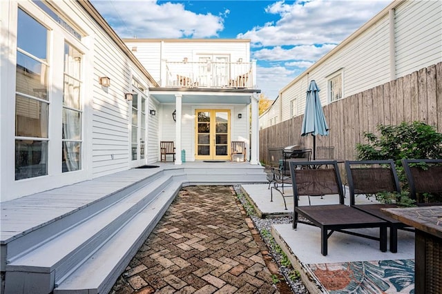 view of patio / terrace with a balcony and a deck