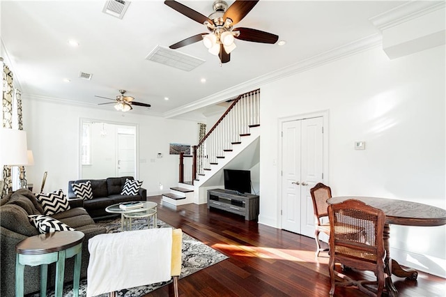 living room with dark hardwood / wood-style floors, ceiling fan, and crown molding