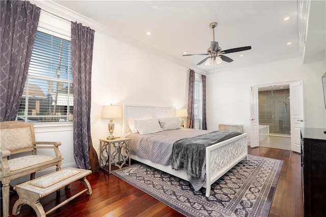 bedroom featuring connected bathroom, ceiling fan, dark hardwood / wood-style flooring, and ornamental molding