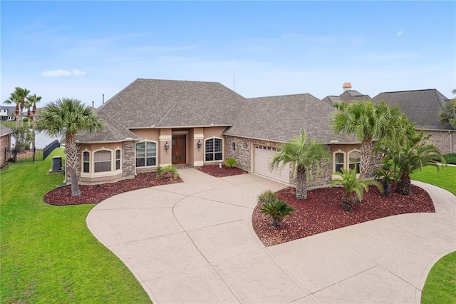 view of front of property featuring stucco siding, a shingled roof, a front lawn, concrete driveway, and a garage