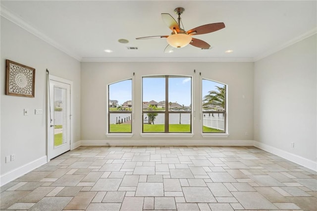 spare room featuring ornamental molding, a water view, and ceiling fan