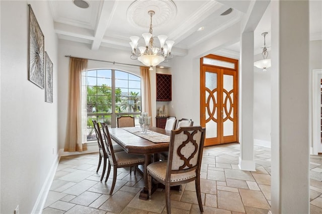 dining room with beamed ceiling, baseboards, and stone tile floors