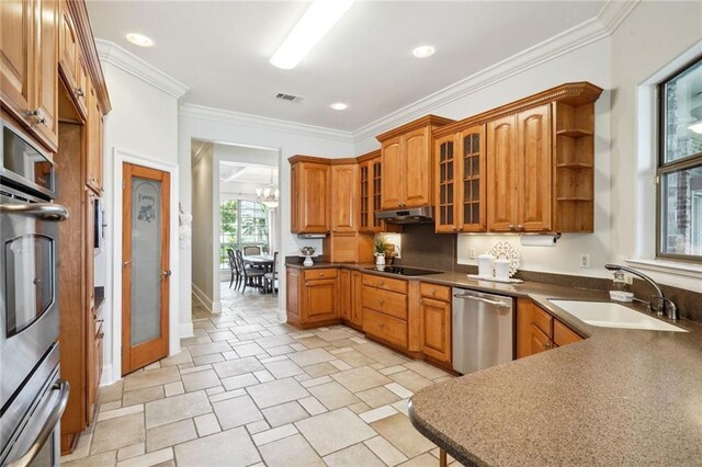 bedroom with multiple windows, a tray ceiling, light hardwood / wood-style flooring, and ornamental molding