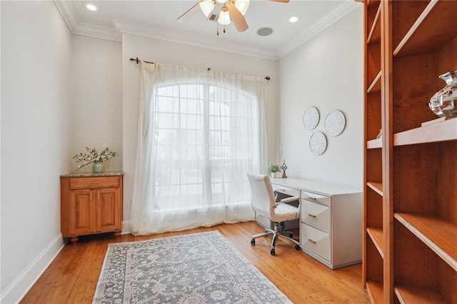 office space with ceiling fan, light wood-type flooring, baseboards, and ornamental molding