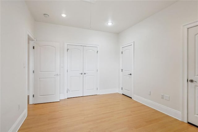 unfurnished bedroom featuring light hardwood / wood-style flooring