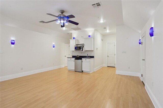 unfurnished sunroom featuring french doors and ceiling fan