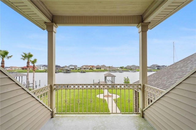 view of patio / terrace featuring a residential view and a water view