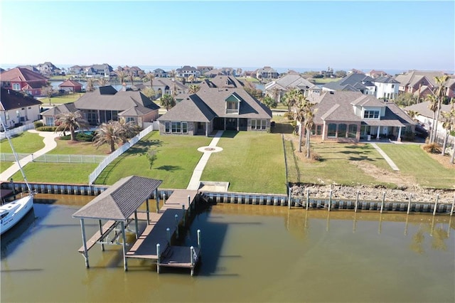 aerial view with a residential view and a water view