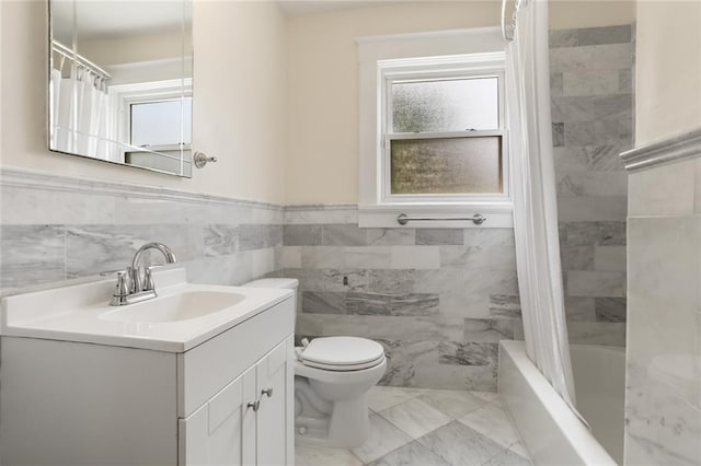 full bathroom with toilet, vanity, shower / bathtub combination with curtain, and tile walls