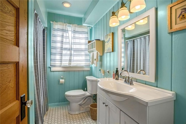 bathroom featuring tile patterned floors, vanity, a shower with shower curtain, and toilet