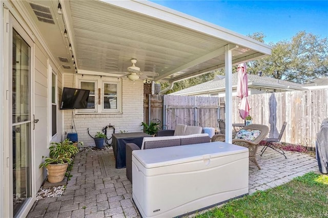 view of patio / terrace featuring an outdoor living space and ceiling fan