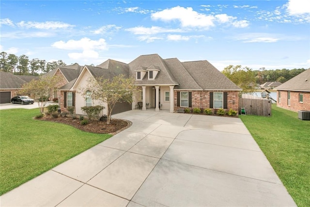 view of front of home with central AC unit and a front lawn