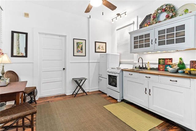 918 Orleans Ave, New Orleans, LA 70116 - kitchen featuring a sink, glass insert cabinets, electric stove, ceiling fan, and dark wood-style flooring