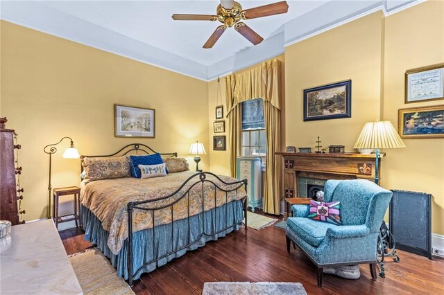 918 Orleans Ave, New Orleans, LA 70116 - bedroom with ceiling fan, a fireplace, and wood finished floors