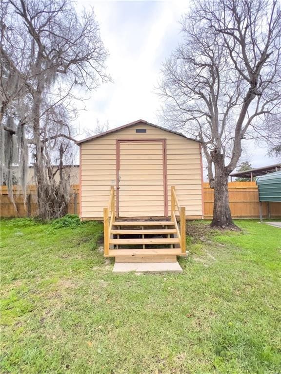 view of shed with a fenced backyard