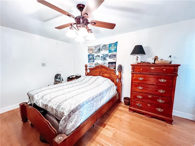 bedroom with light hardwood / wood-style flooring and ceiling fan