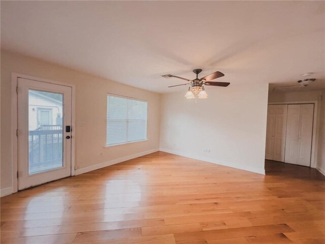 full bathroom with tile patterned flooring, toilet, vanity, baseboards, and a tub