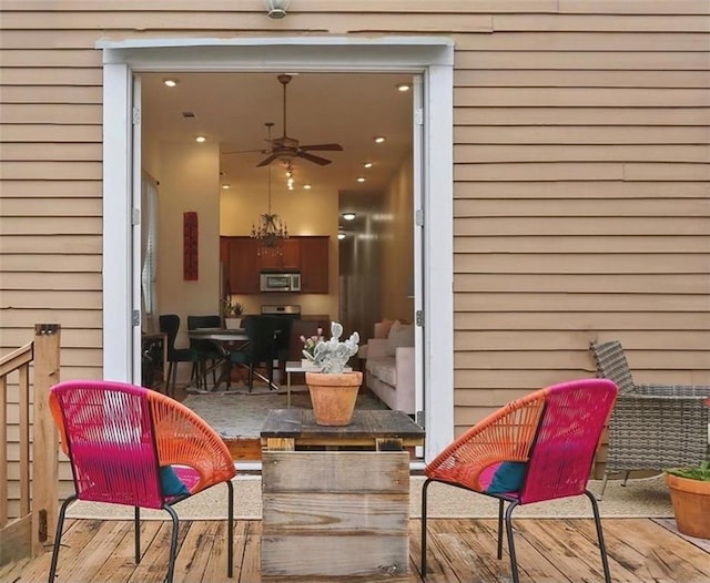 view of patio / terrace featuring ceiling fan and a deck