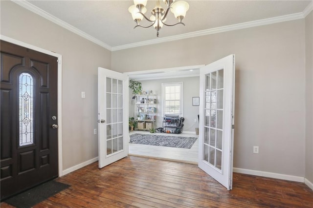 entrance foyer with french doors, crown molding, and dark wood-type flooring