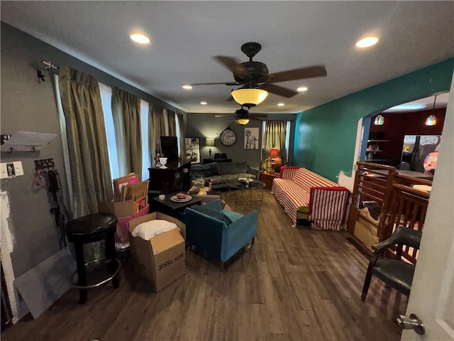 bedroom with hardwood / wood-style floors, refrigerator, and ceiling fan