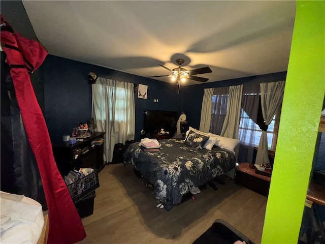 bedroom featuring hardwood / wood-style flooring and ceiling fan