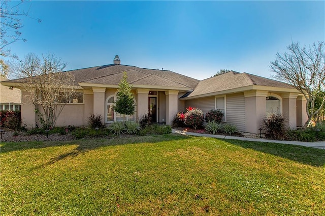 ranch-style house with a front lawn