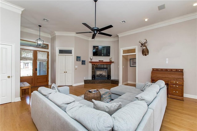 26 Pine Ln, Hammond, LA 70401 - living area with crown molding, light wood-style flooring, and visible vents