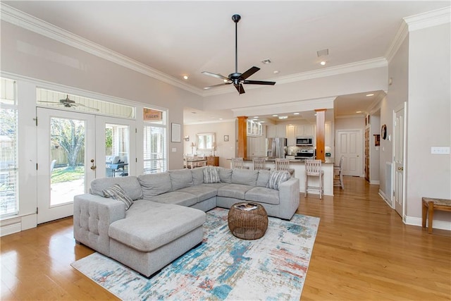 26 Pine Ln, Hammond, LA 70401 - living area with light wood-type flooring, crown molding, a ceiling fan, and french doors